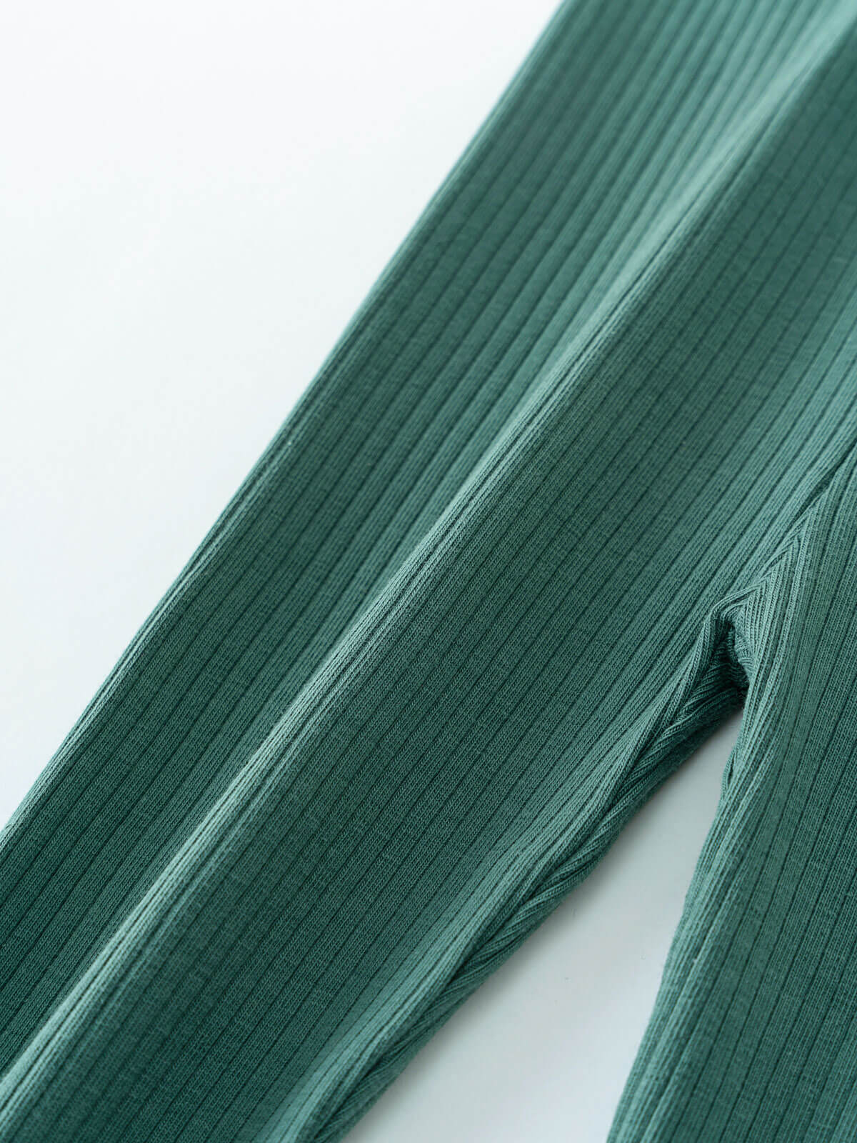 Close-up of teal ribbed fabric leggings on white background Baby Ribbed Leggings - Balsam Baby girl