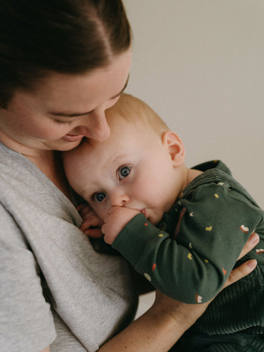 Mother holding baby wearing green long sleeve bodysuit with small print pattern Long Sleeve Bodysuit - Mountain View Balsam Baby boy