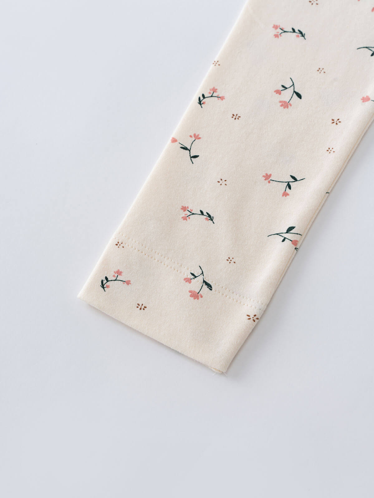 Cream fabric with small pink floral and green leaf pattern Printed Leggings - Wild Meadow Ecru Girls