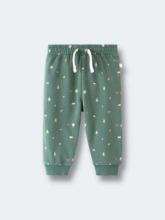 Green sweatpants with forest pattern and white drawstring on flat surface Printed Sweatpants - Mountain View Balsam Baby boy
