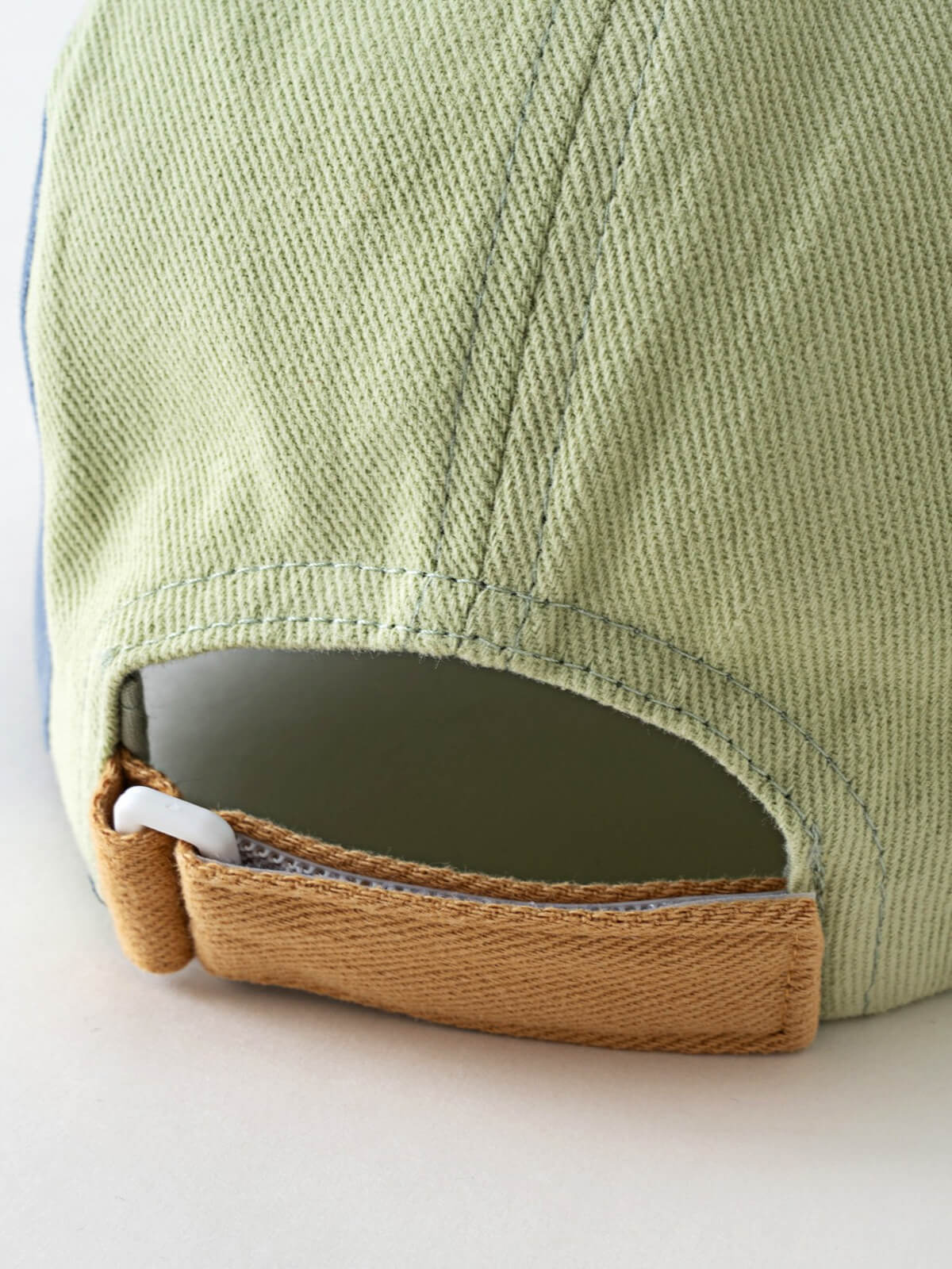 Close-up of light green corduroy baseball cap with tan adjustable strap Brocks Cap - Calla Green Boys