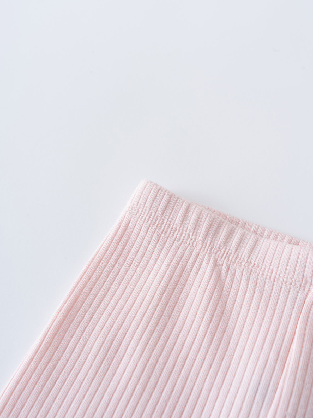 Close-up of ribbed pink fabric against a light background Brooklyn Leggings - Candy Floss Baby girl