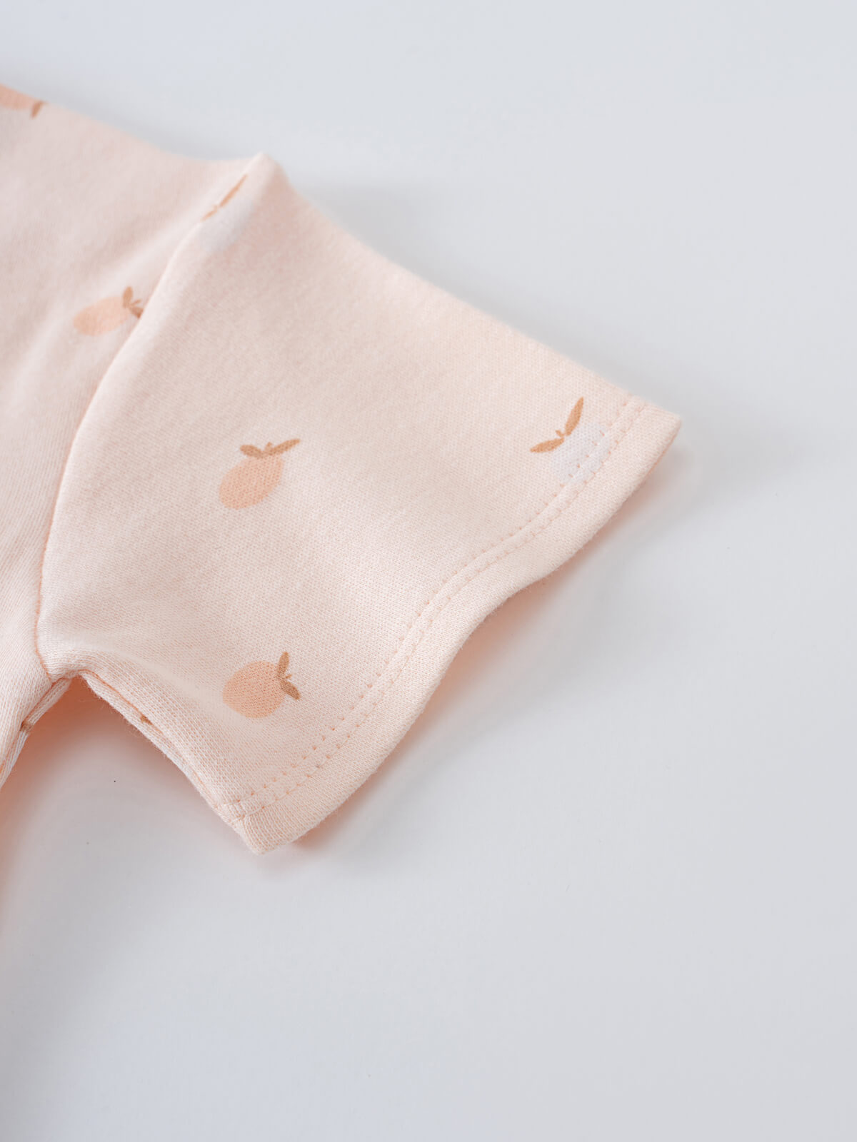 Close-up of a pale pink sleeve with small embroidered apple details Grace Short Sleeve Tee - Apples Baby girl