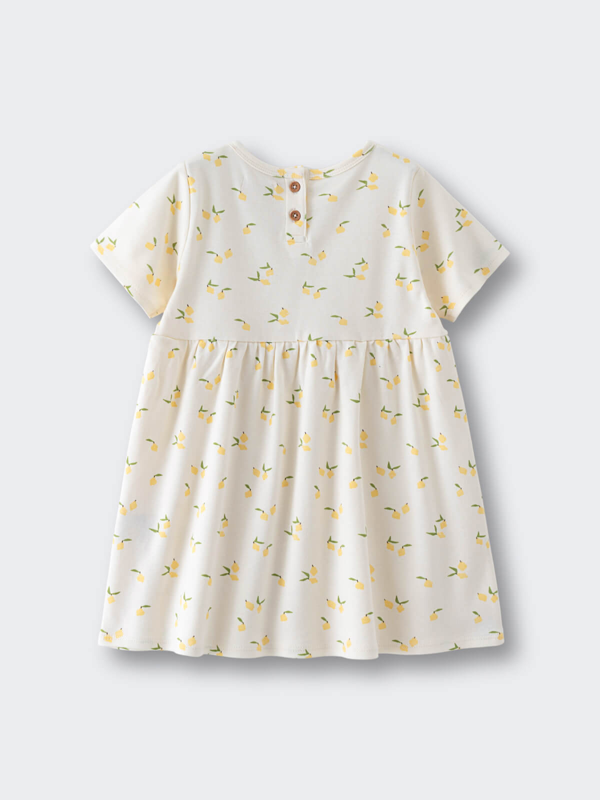 White dress with yellow lemon print and button closure at back Lucia Dress - Lemons Baby girl