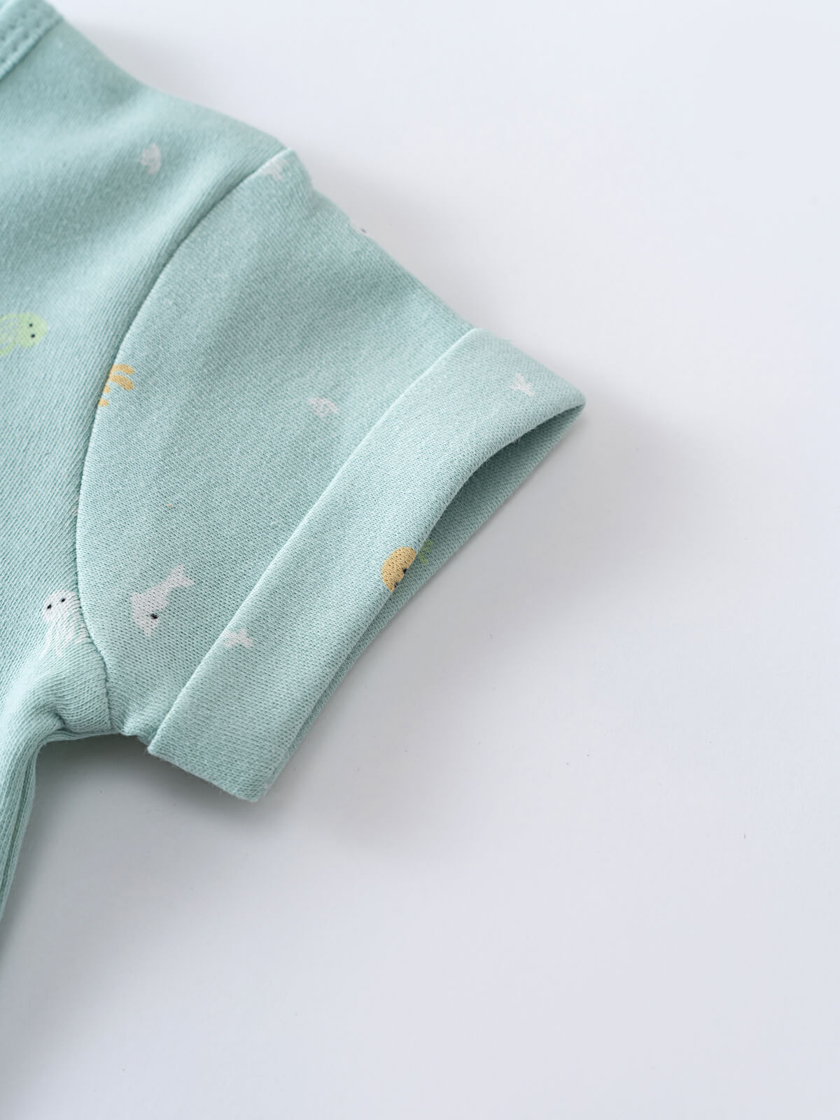 Close-up of a light blue baby garment sleeve with small embroidered details Oliver Short Sleeve Onesie - Sea Friends Baby boy