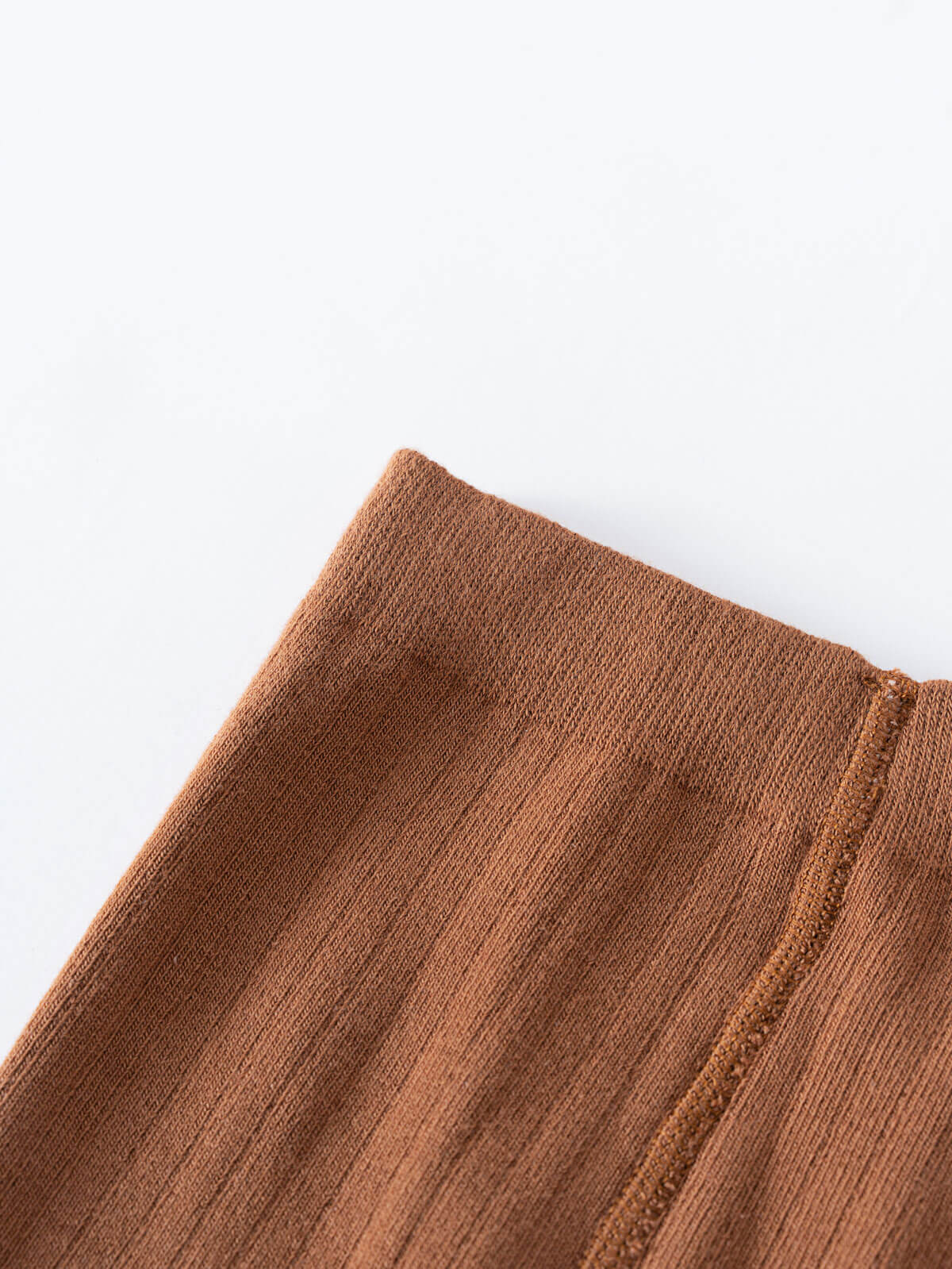Close-up of brown ribbed fabric showing texture and stitched seam detail Ribbed Tights 2 Pack - Rosehip/Russet Girls