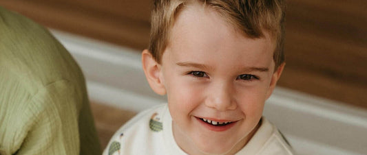 Smiling boy in the Tortie printed sweatshirt, a gift for a 2 year old that gets worn every day