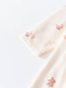 Close-up of cream-colored fabric with pink animal embroidery pattern Baby Long Sleeve Jersey Dress - Meadow Friends Ecru Baby girl