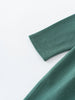 Close-up of teal green fabric sleeve with visible stitching detail Baby Long Sleeve Jersey Dress - Meadow Friends Baby girl