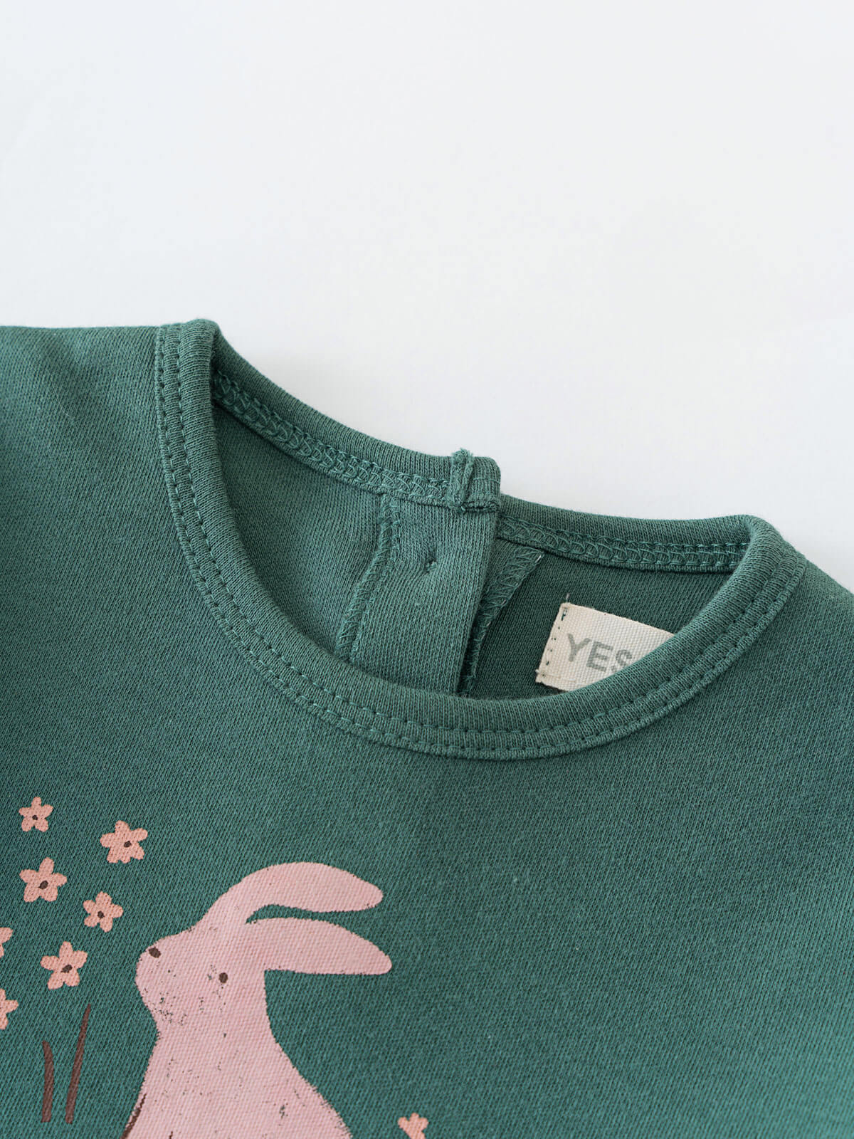 Close-up of green jersey fabric with pink rabbit and flower print Baby Long Sleeve Jersey Dress - Meadow Friends Baby girl