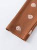 Close-up of brown fabric leg cuff with small bear print pattern Baby Printed Leggings - Cosy Bear Russet Baby boy