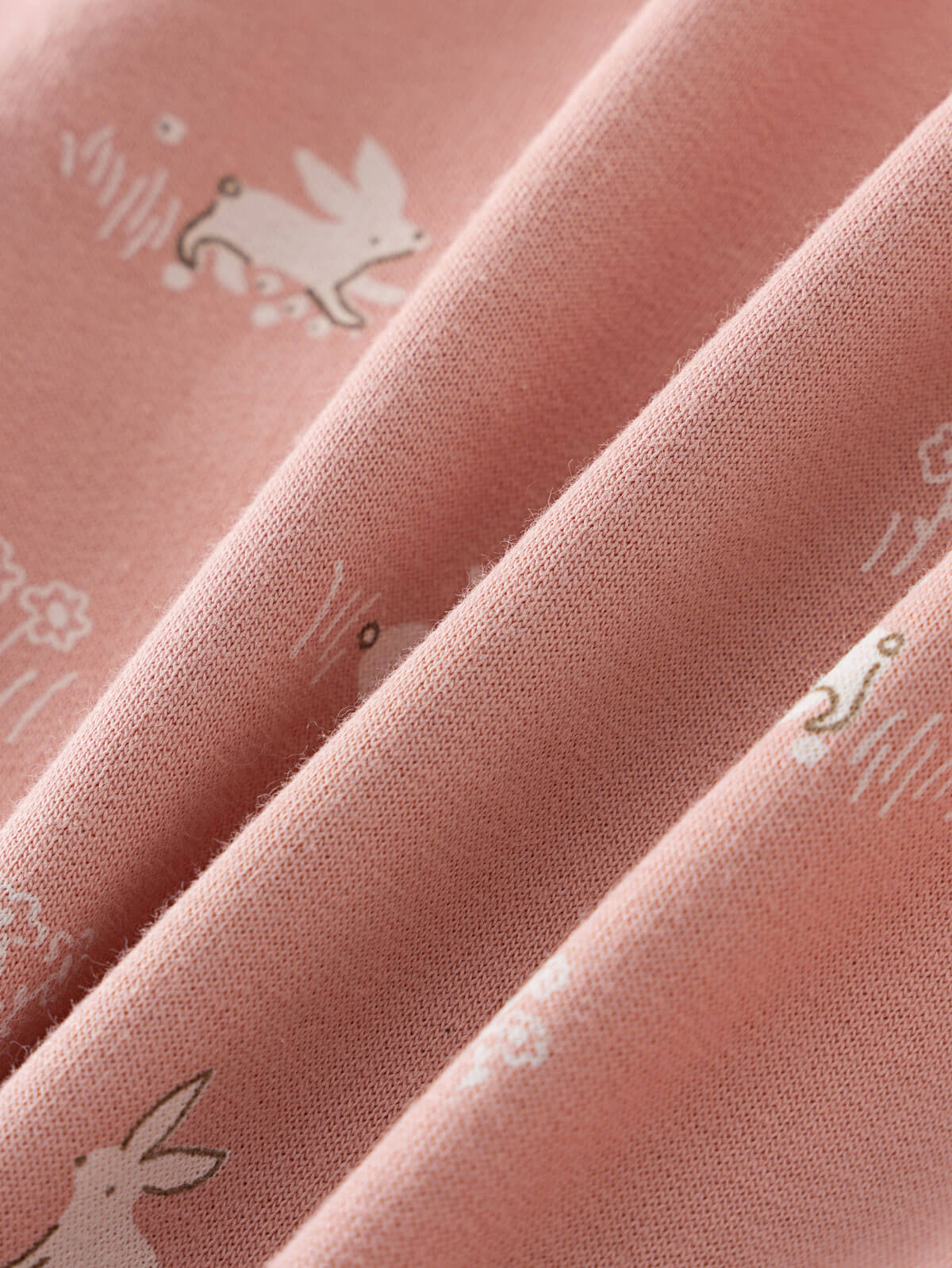 Close-up of pink fabric with white animal prints showing texture and folds Baby Printed Sweatshirt - Meadow Friends Blush Baby girl