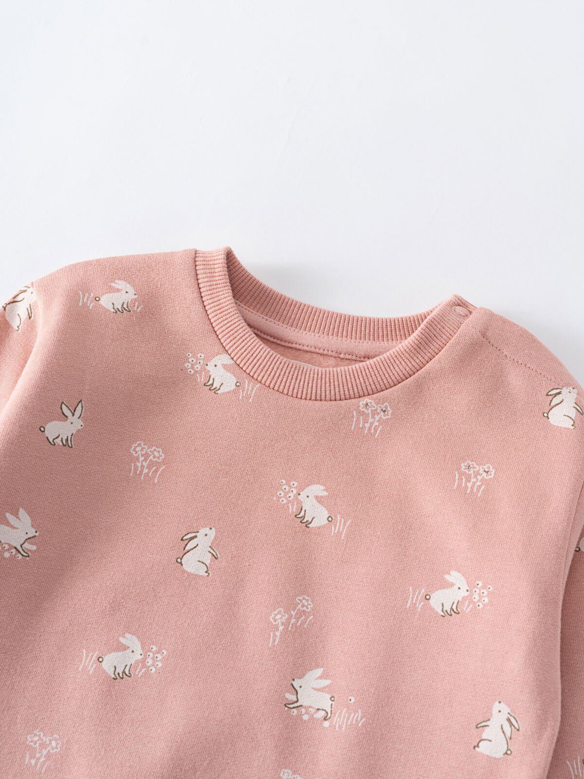 Close-up of a pink sweatshirt with white rabbit print pattern Baby Printed Sweatshirt - Meadow Friends Blush Baby girl