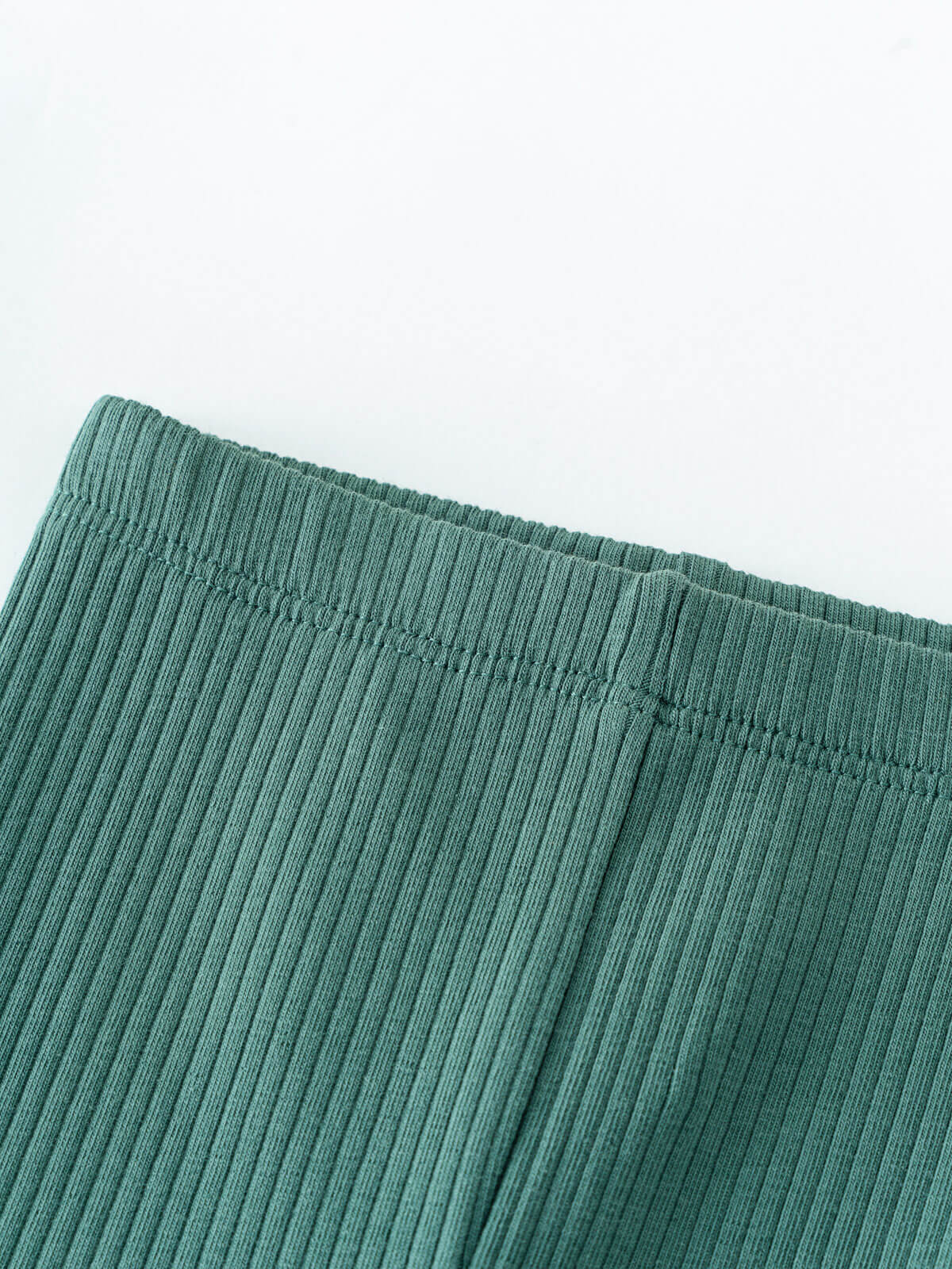 Close-up of teal ribbed fabric with elastic waistband detail Baby Ribbed Leggings - Balsam Baby girl