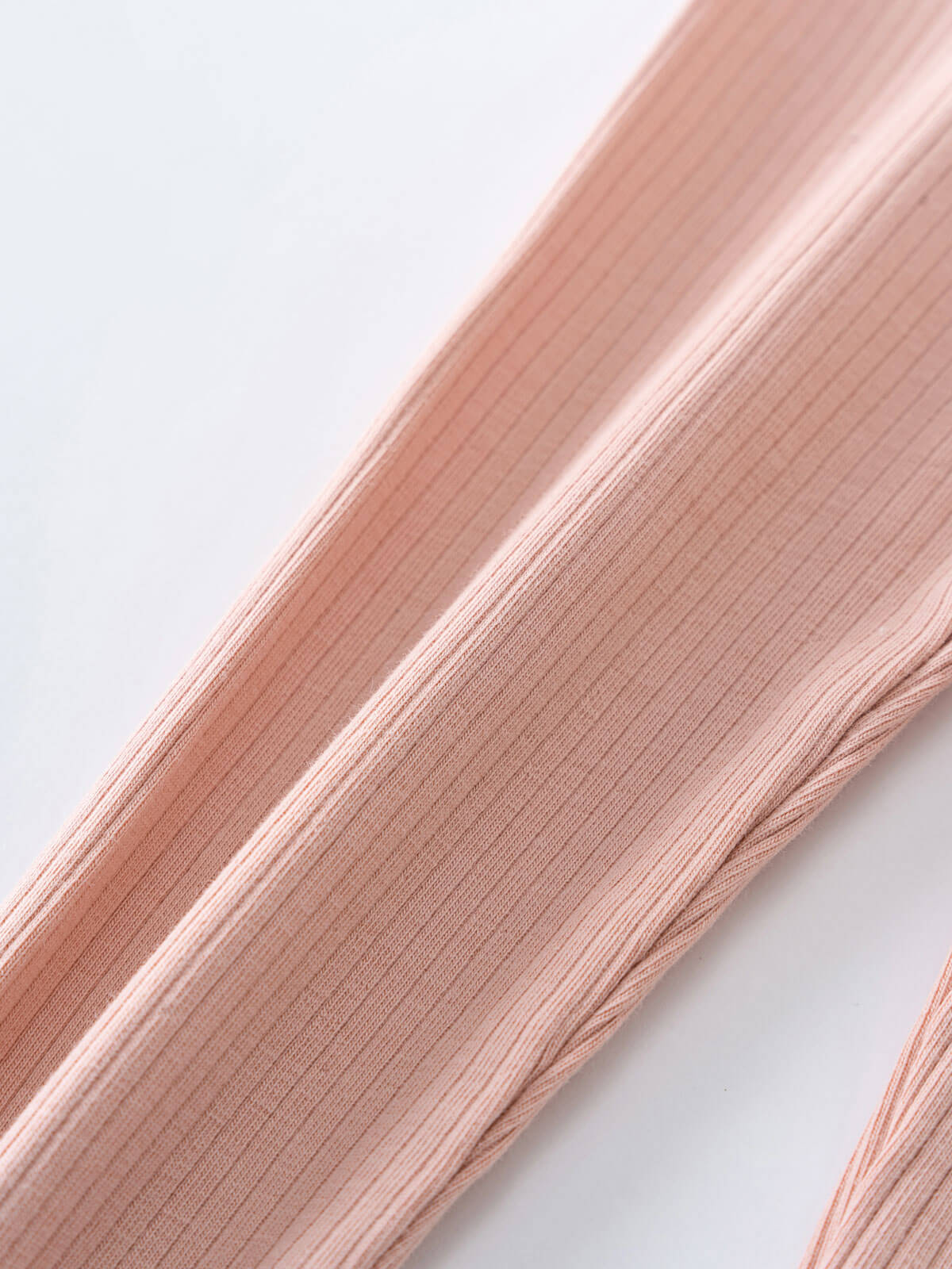 Close-up of ribbed fabric leggings in blush pink color Baby Ribbed Leggings - Blush Baby girl