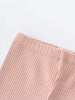 Close-up of pink ribbed fabric showing texture and stitching detail Baby Ribbed Leggings - Blush Baby girl