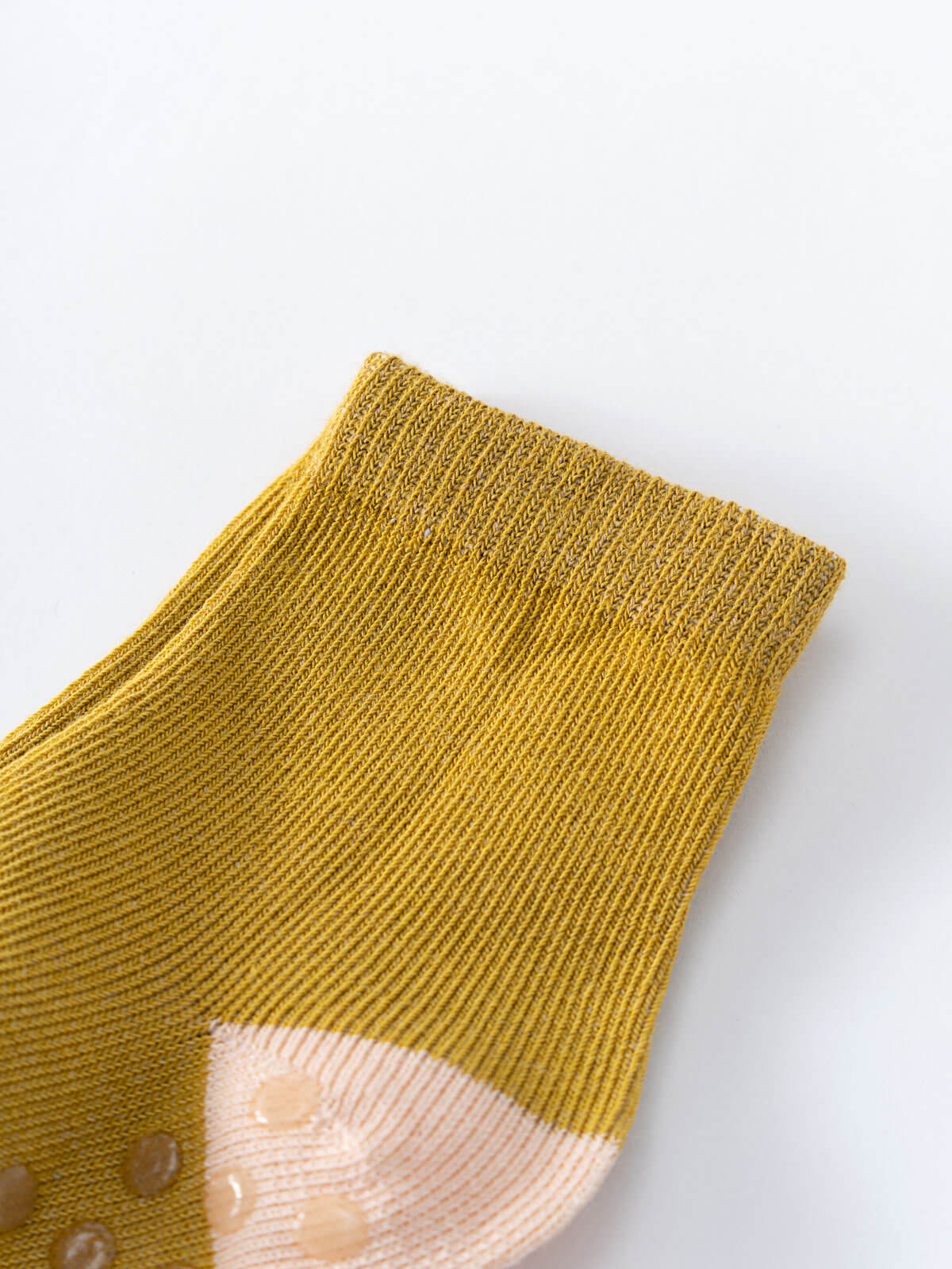 Close-up of a mustard yellow ribbed sock with contrasting peach heel and toe Baby Socks -3 Pack - Acorn Baby girl