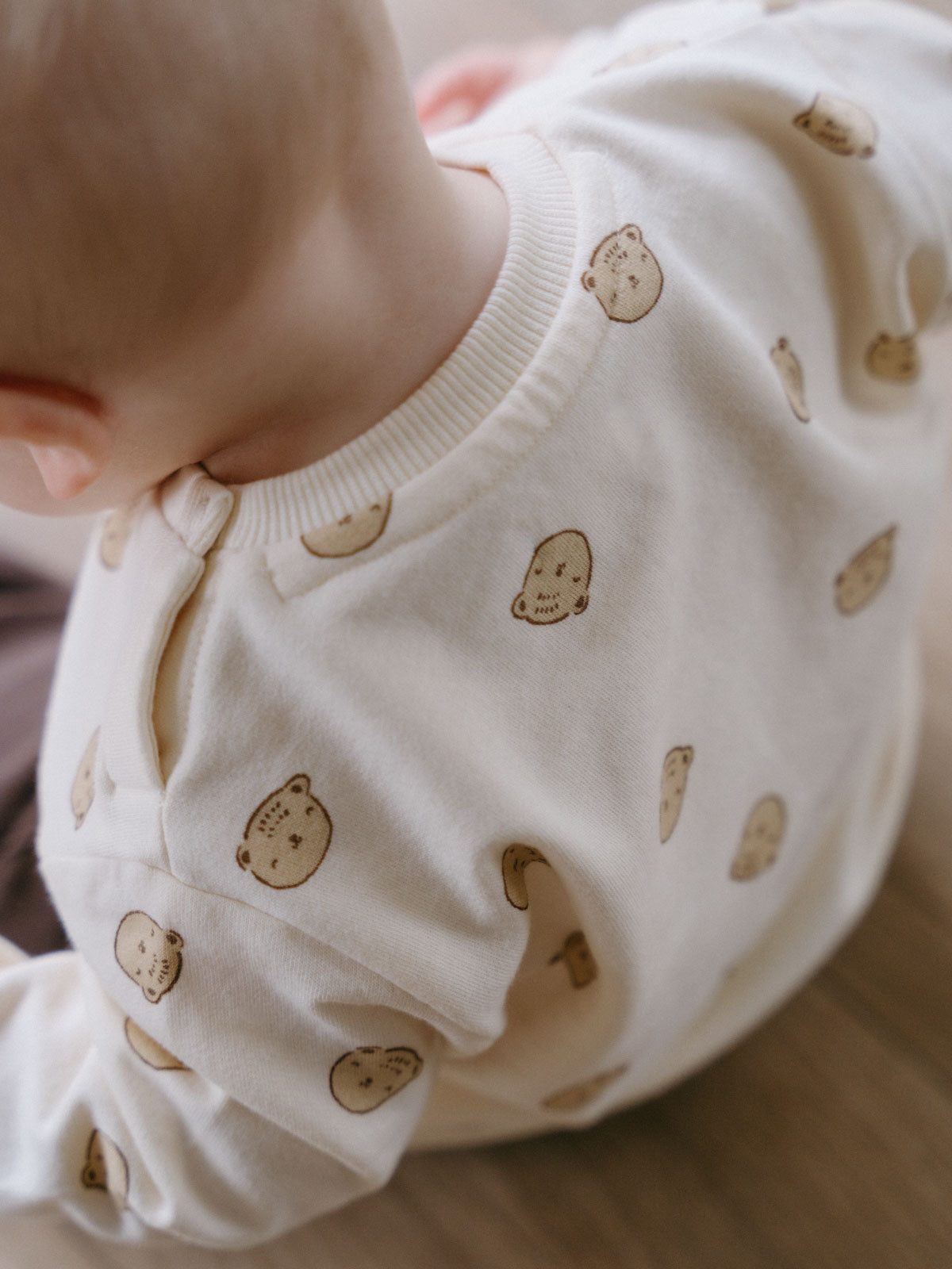 Baby wearing white sweatshirt with bear print pattern lying down Baby Printed Sweatshirt - Cosy Bear Ecru Baby boy