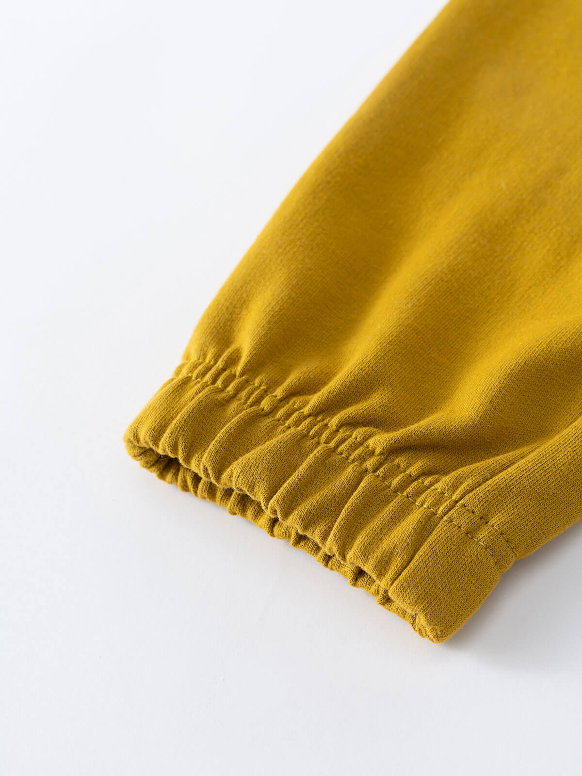 Close-up of mustard yellow fabric cuff with elastic gathering Cargo Sweatpants - Golden Pear Boys