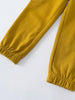 Close-up of mustard yellow sweatpants showing elastic cuffs and ribbed texture Cargo Sweatpants - Golden Pear Boys