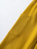Close-up of a mustard yellow sweatpant pocket detail on fabric Cargo Sweatpants - Golden Pear Boys