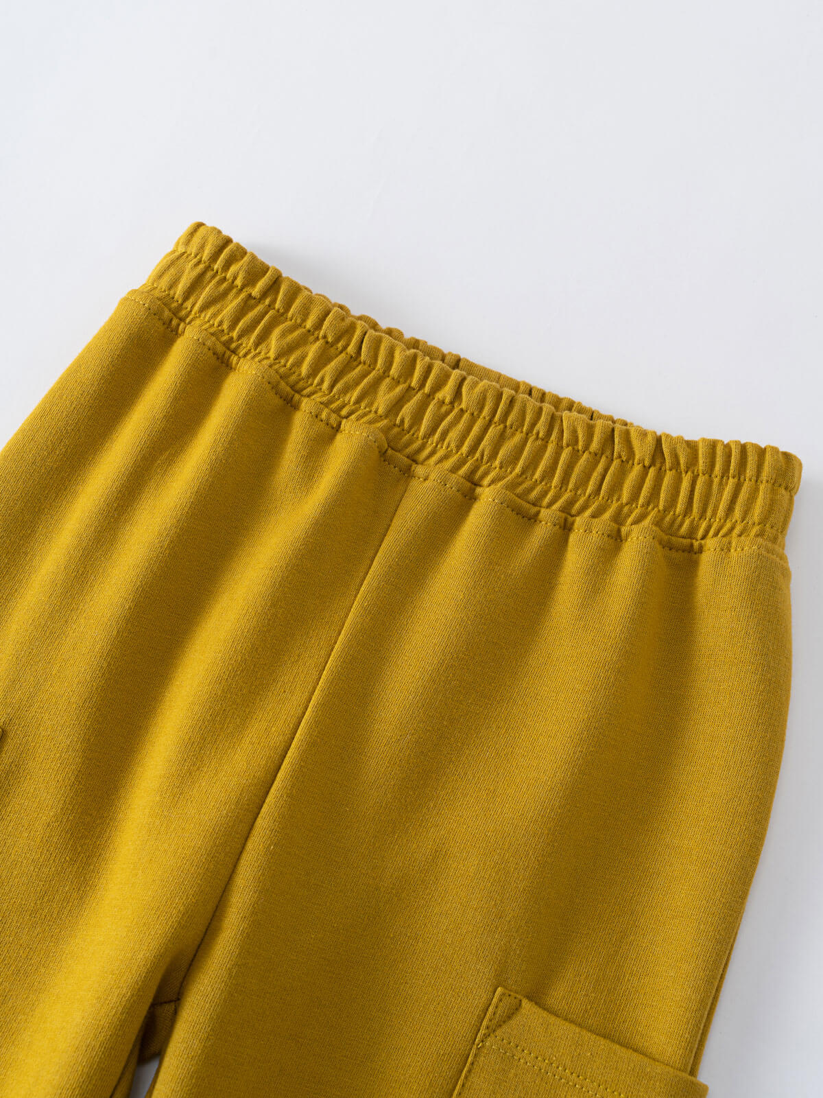Close-up of mustard yellow sweatpants waistband with elastic and cargo pocket detail Cargo Sweatpants - Golden Pear Boys