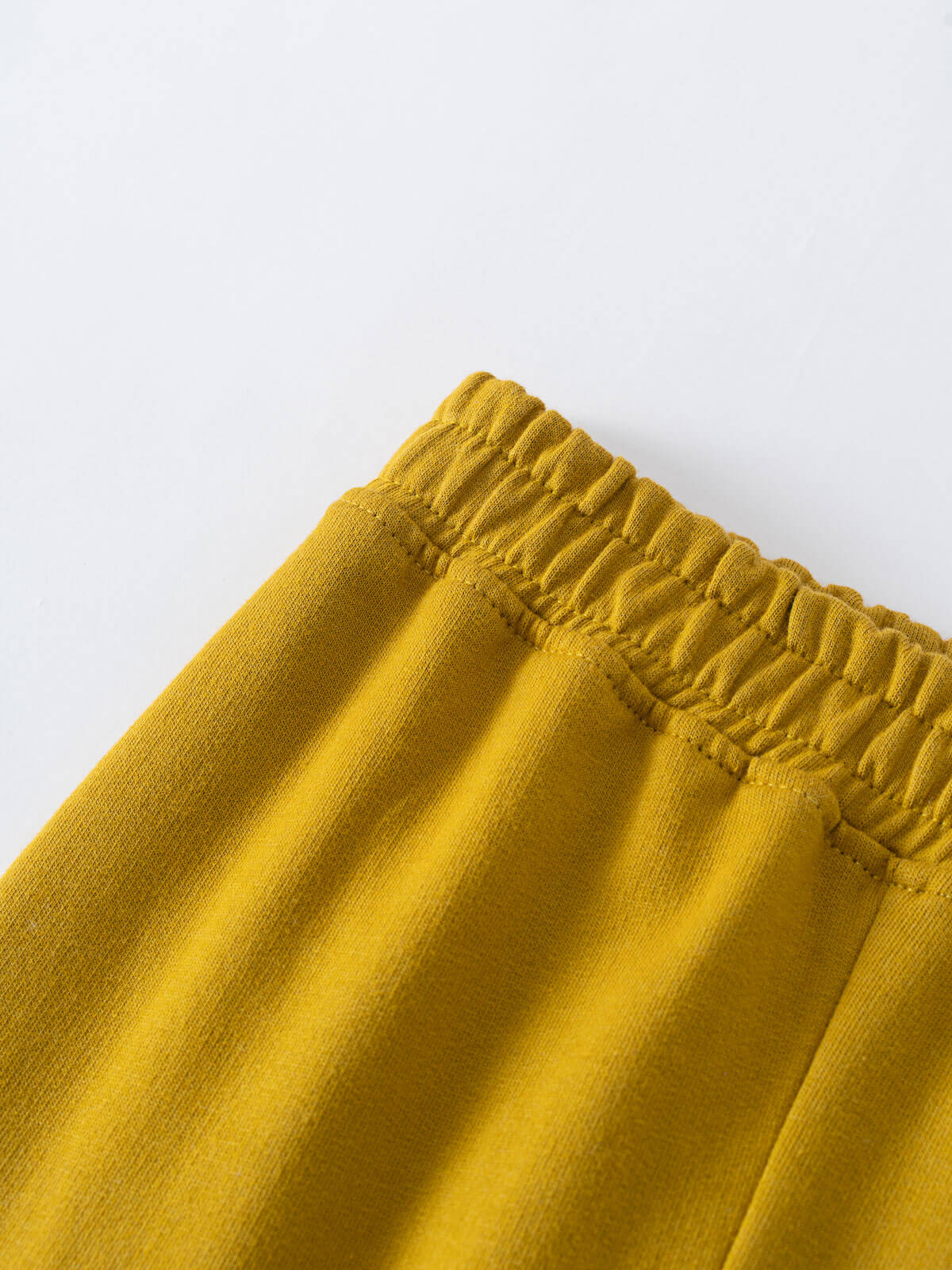 Close-up of golden yellow sweatpants waistband with elastic gathering Cargo Sweatpants - Golden Pear Boys