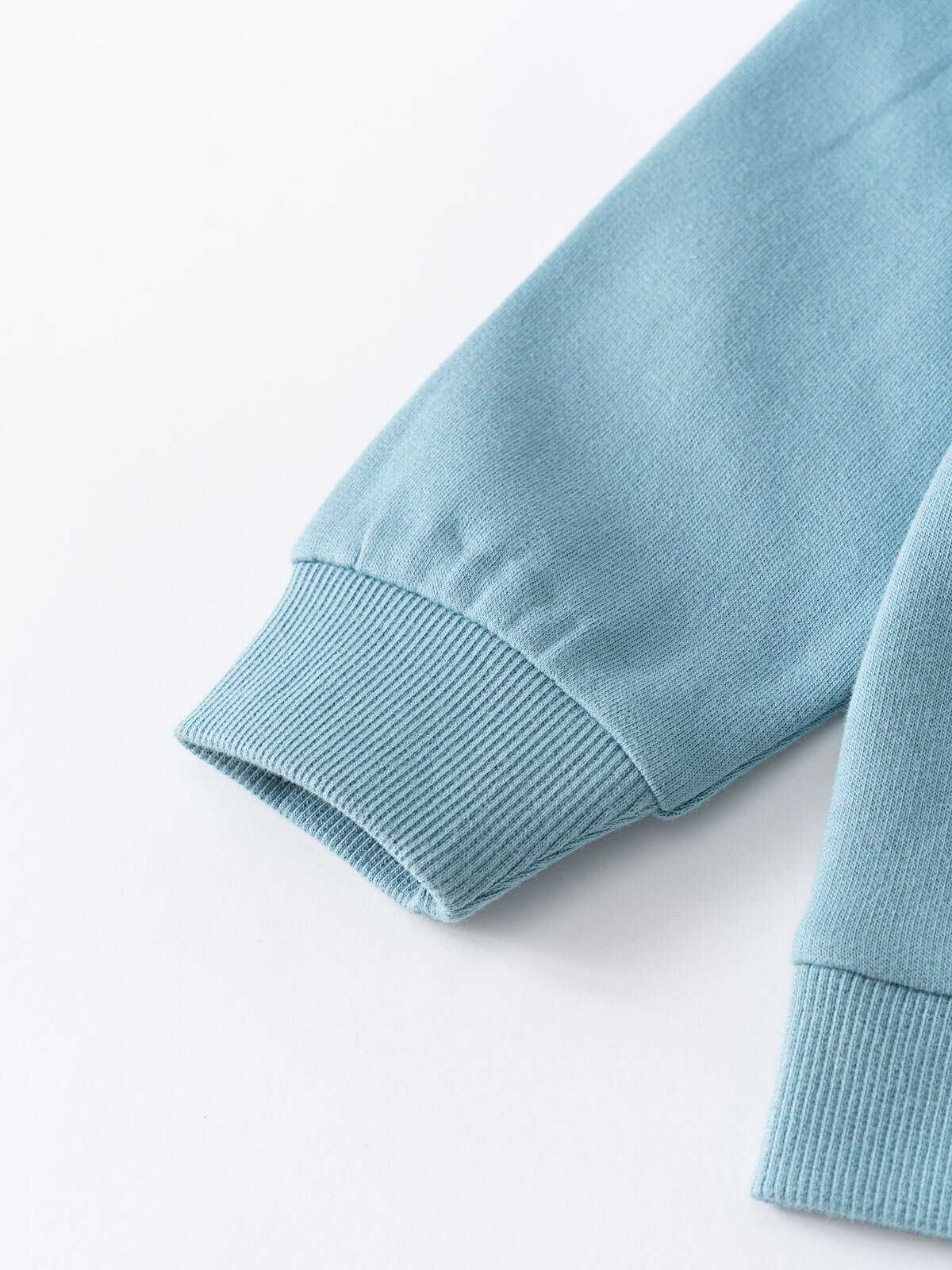 Close-up of a light blue ribbed cuff on a sweatshirt sleeve Feature Print Hoodie - Stay Wild Boys