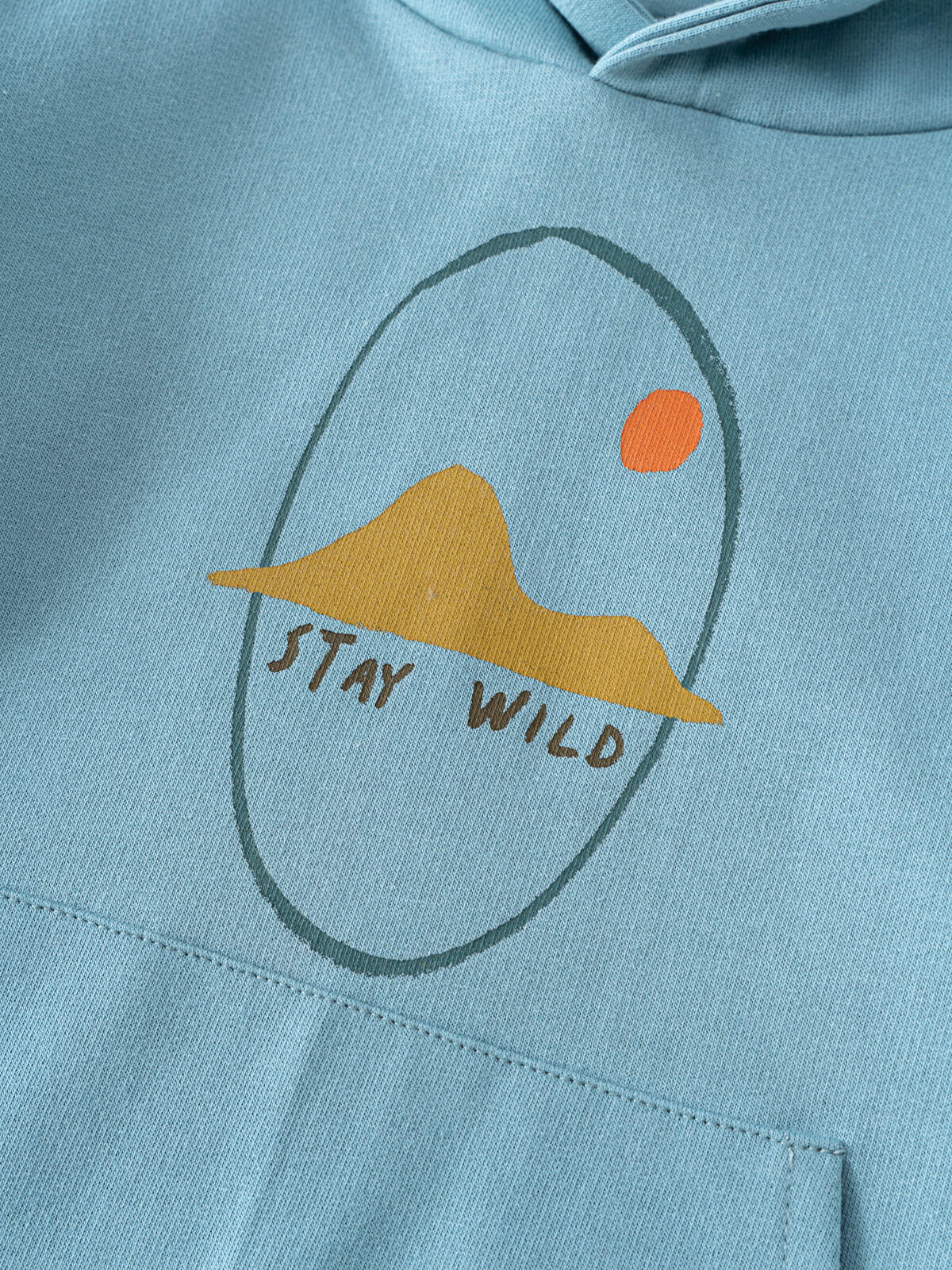 Light blue hoodie with printed design showing mountain and sun graphic Feature Print Hoodie - Stay Wild Boys