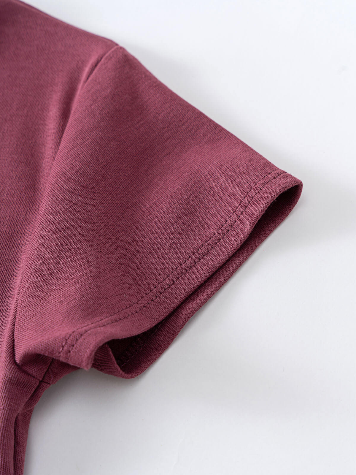 Close-up of a mauve colored t-shirt sleeve on white background Feature Print Short Sleeve Tee - Forest Gathering Girls