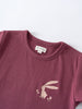 Close-up of a burgundy t-shirt with a rabbit and mushroom print Feature Print Short Sleeve Tee - Forest Gathering Girls