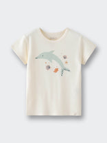 Cream colored children's t-shirt with dolphin and seashell graphic design Feature Print Short Sleeve Tee - Dolphin Short Sleeve Tee Shirt - Dolphin Girls