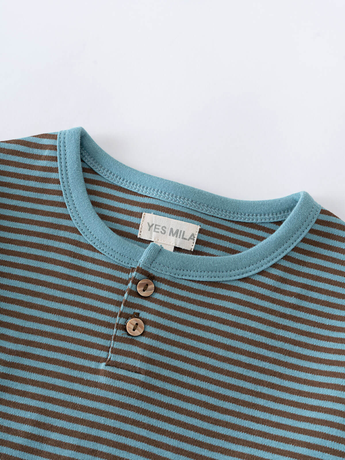 Close-up of striped blue and brown shirt with two buttons Henley Long Sleeve Tee - Lake Boys