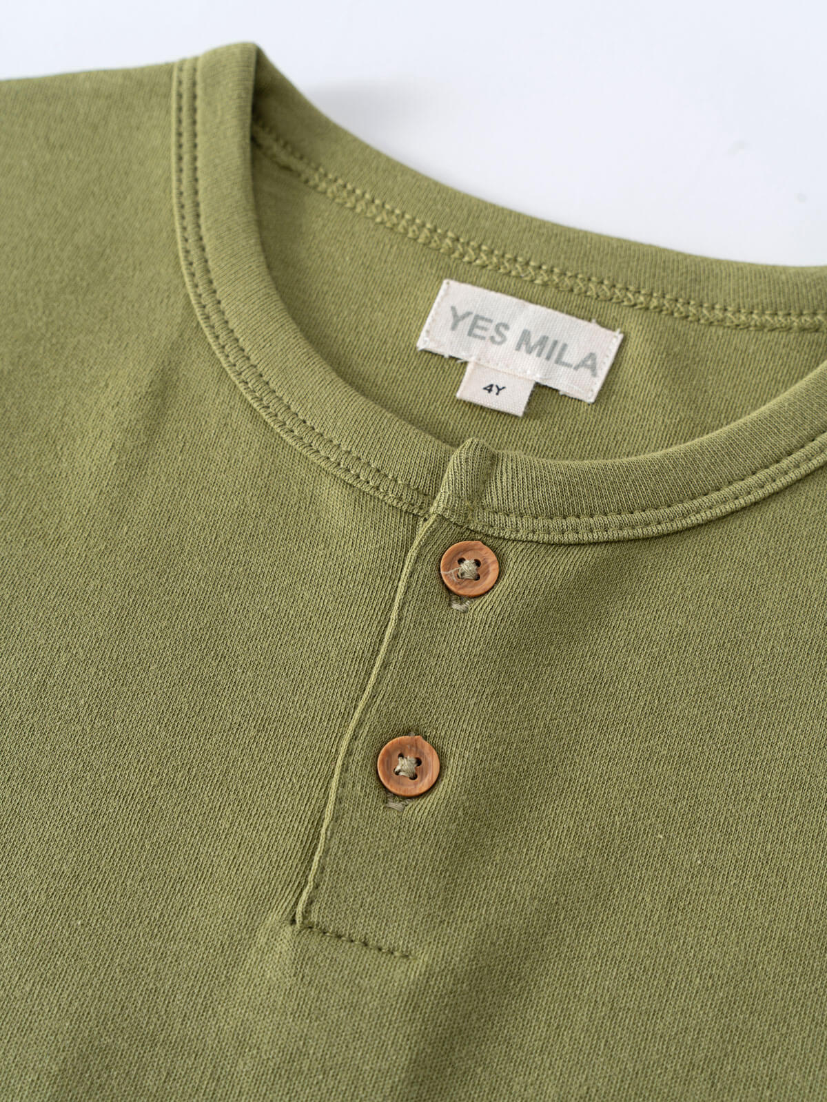 Close-up of olive green henley shirt collar with two brown buttons Henley Short Sleeve Tee - Moss Boys
