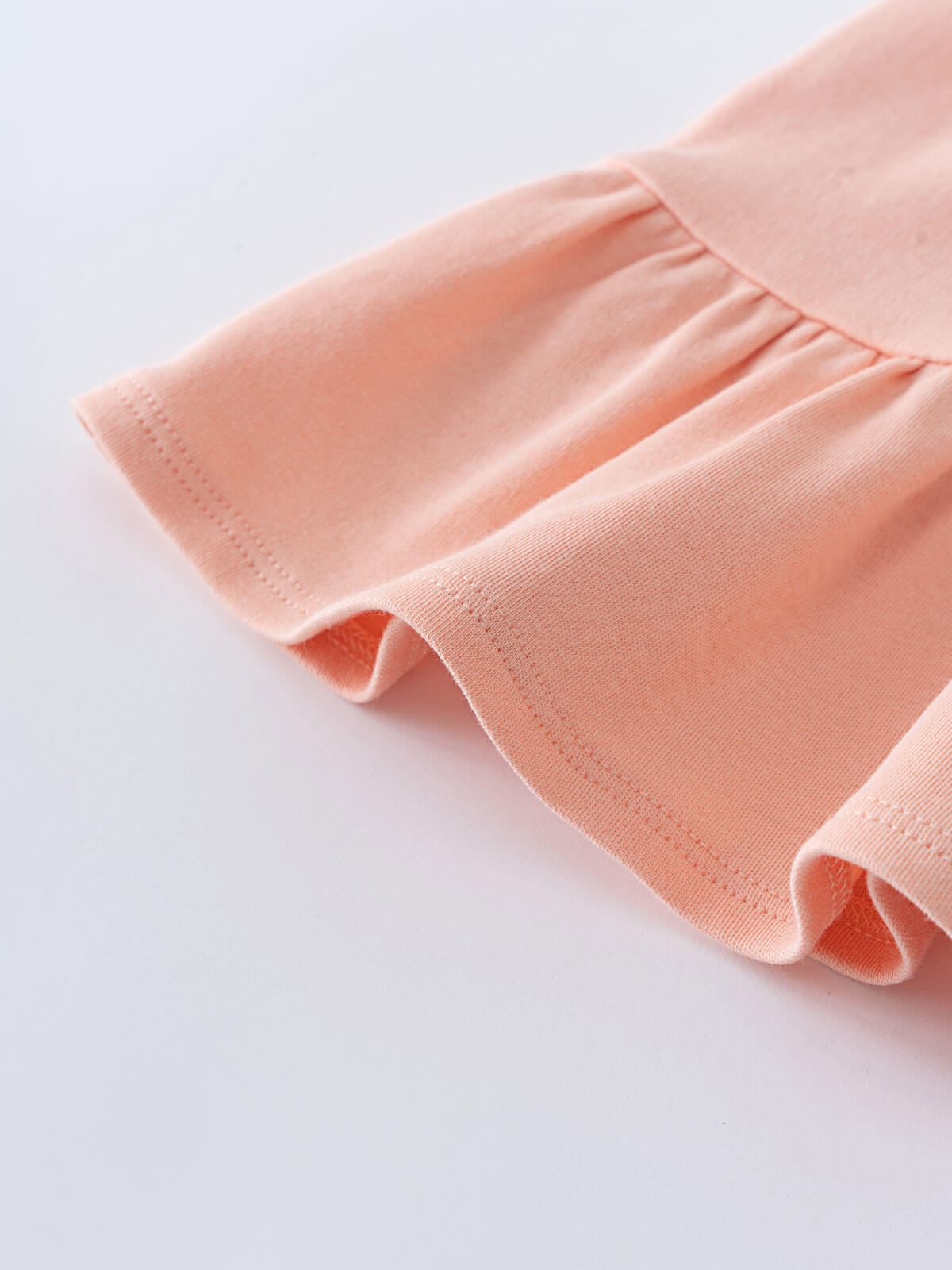 Close-up of a pale pink jersey skirt sleeve with gathered elastic cuff Jersey Skirt - Mallow Girls