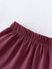 Close-up of burgundy fabric with gathered elastic waistband detail Jersey Skirt - Plum Jam Girls