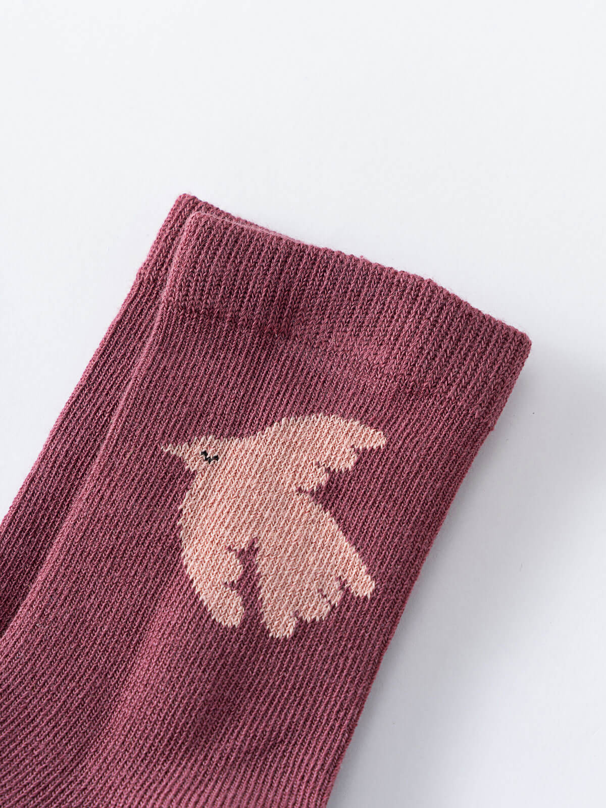 Close-up of a mauve sock with a knitted dove design Kids Socks 3 Pack - Dove Girls
