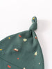 Green fabric baby hat with knotted top featuring small printed motifs Knot Hat - Mountain View Balsam Baby boy