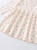Close-up of cream fabric with small pink and peach floral print Long Sleeve Jersey Dress - Bird And Blossom Ecru Girls