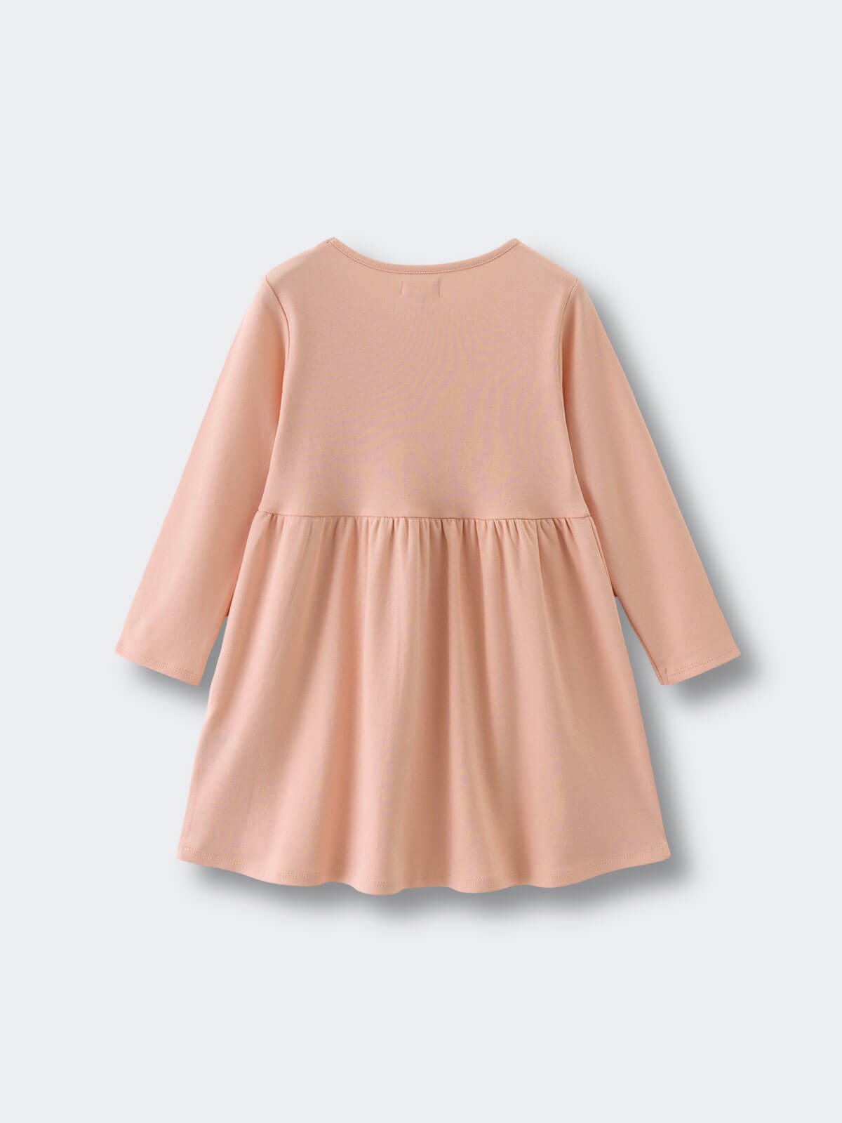 Back view of a peach-colored long sleeve dress with gathered skirt Long Sleeve Jersey Dress - Mallow Girls