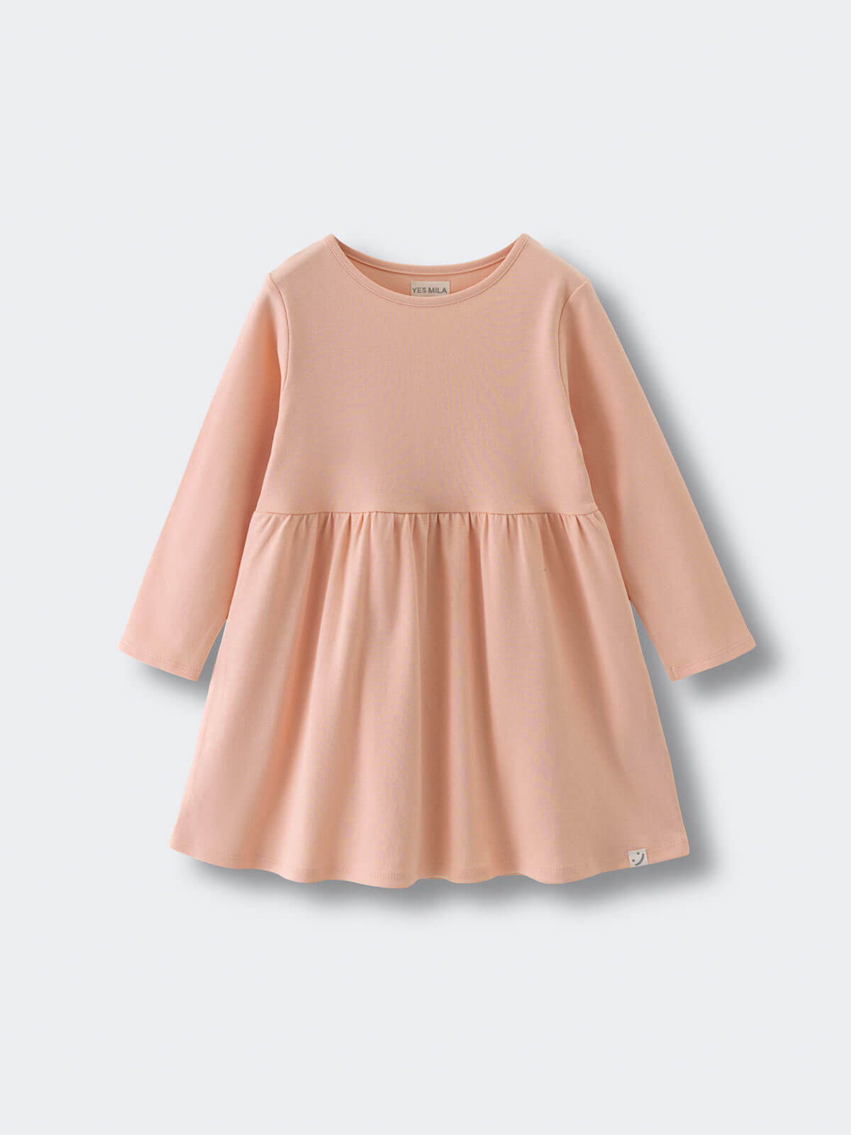 Peach-colored long sleeve dress with gathered skirt on light background Long Sleeve Jersey Dress - Mallow Girls