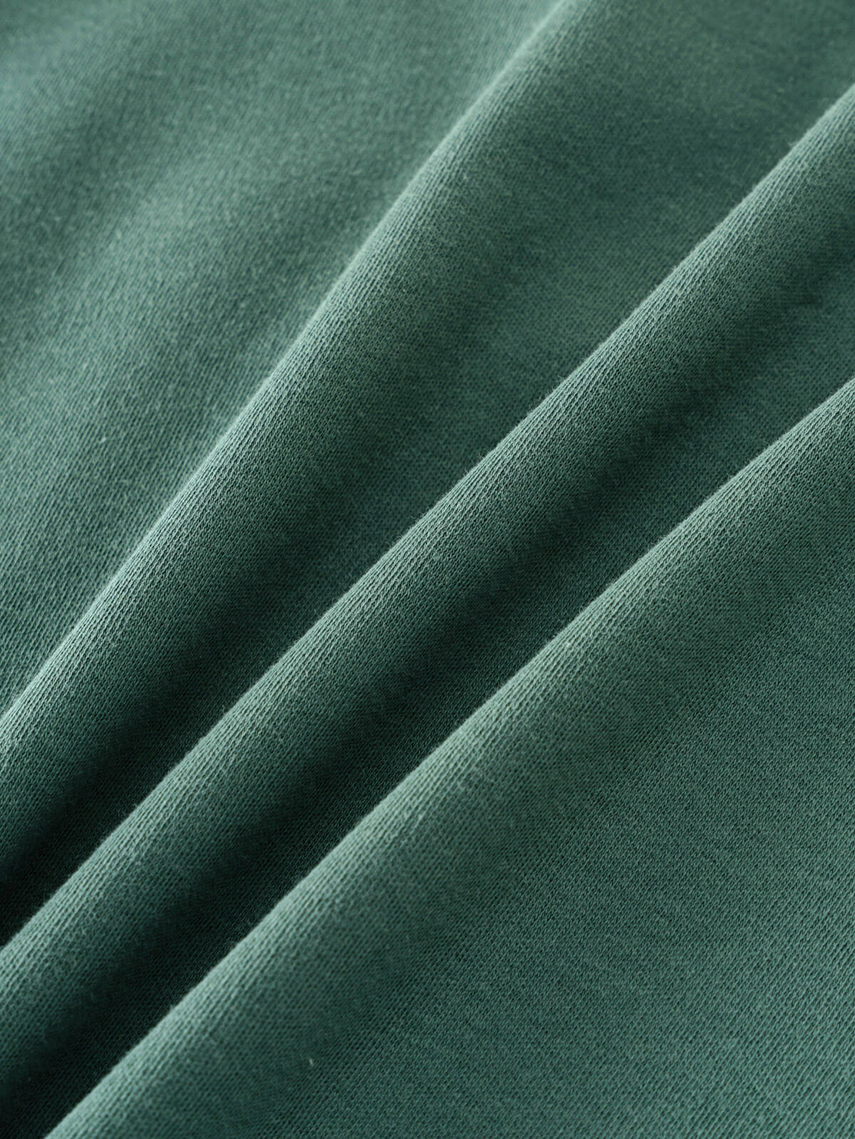 Close-up of sage green fabric with soft folds and texture Long Sleeve Tee - Balsam Boys