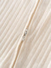 Close-up of a textured fabric with a zipper on a beige background Pointelle Long Sleeve One Piece - Ecru Baby boy
