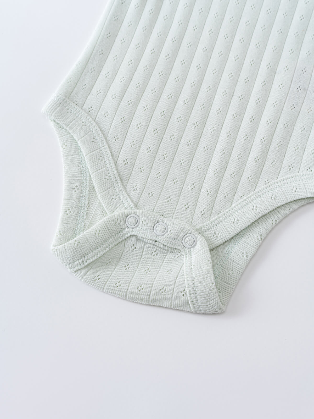 Close-up of a pale green ribbed knit bodysuit with snap buttons Pointelle Singlet Bodysuit - Sea Foam Baby boy