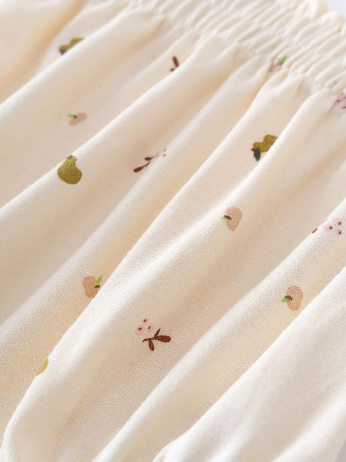 Close-up of cream fabric with small printed fruit and vegetable motifs Printed Bloomers - Autumn Harvest Ecru Baby girl