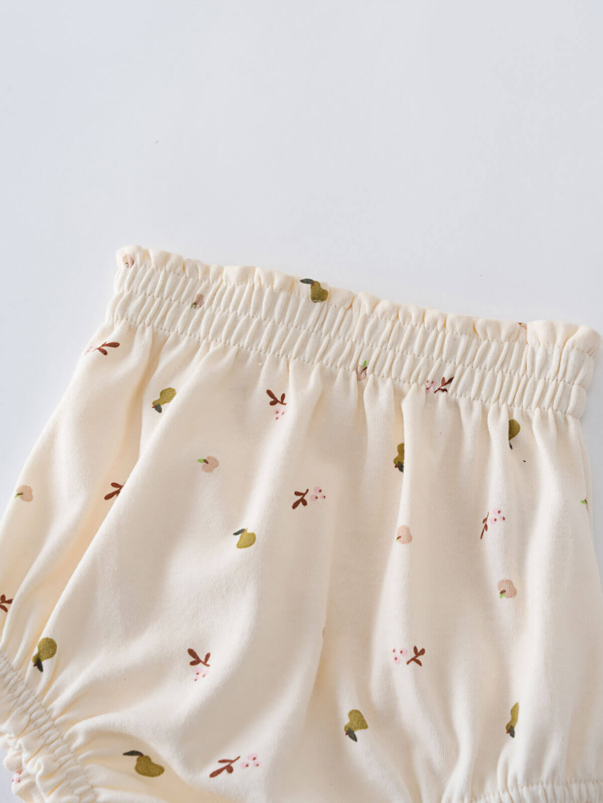 Close-up of cream-colored bloomers with small floral and leaf print details Printed Bloomers - Autumn Harvest Ecru Baby girl