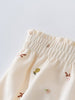 Close-up of cream-colored gathered bloomers with small floral and branch embroidery Printed Bloomers - Autumn Harvest Ecru Baby girl