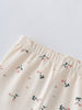 Close-up of cream-colored leggings with small pink floral embroidery pattern Printed Leggings - Wild Meadow Ecru Girls