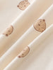 Close-up of cream fabric with small brown bear face prints Printed Long Sleeve One Piece - Cosy Bear Ecru Baby boy