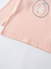 Close-up of pale pink long sleeve shirt with white bear and flower graphic Printed Long Sleeve Tee - Dove Girls